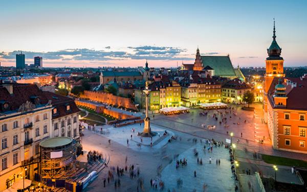 Warsaw town square at dusk with lights, stock photo